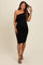 woman wearing a black one-shoulder maternity dress with a ruffle detail and a visible baby bump