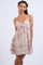 woman wearing a floral tiered mini dress with spaghetti straps and ruffle details
