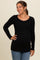 woman wearing a black long sleeve ribbed maternity top and showcasing her baby bump