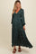 woman wearing a dark green floral maternity maxi dress with long sleeves and a visible baby bump