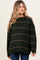 woman wearing a dark green striped maternity sweater with long sleeves and a relaxed fit
