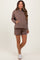 woman wearing a brown maternity hoodie with a front pocket and matching shorts