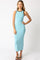 woman wearing a light blue sleeveless maxi dress with black trim and heels