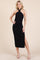 woman wearing a black halter neck midi dress with a side slit and ruching detail
