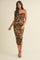 woman wearing a leopard print bodycon midi dress with ruching details and thin spaghetti straps