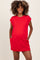 woman wearing a red maternity dress with short sleeves and side pockets, showing her baby bump