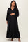 woman wearing a black long sleeve maternity dress with a button-up collar and ruffled hem, and showing her baby bump