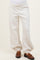 maternity wear cream oversized sweatpants with elastic cuffs, worn by a model with a visible baby bump