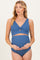 woman wearing a blue ribbed maternity bikini top and high-waisted bottoms, holding her baby bump