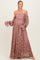 woman wearing a dusty rose off-the-shoulder lace maternity dress with bell sleeves and a visible baby bump