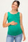 woman wearing a green maternity tank top and holding her baby bump