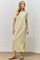 woman wearing a yellow and white striped short sleeve maxi dress with a side slit and a relaxed fit