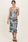woman wearing a floral printed maternity dress with a fitted silhouette and a visible baby bump