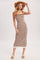 woman wearing a sleeveless brown and white striped knit midi dress and a straw hat
