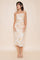 woman wearing a strapless floral midi dress with ruching details, posing against a neutral background