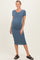 woman wearing a blue ribbed maternity dress with short sleeves and a visible baby bump
