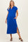 woman wearing a bright blue maternity dress with short sleeves, a collar, and side slits, featuring pockets