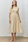 woman wearing a light beige button-up midi dress with smocked bodice and short sleeves