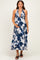 woman wearing a navy floral maternity maxi dress and holding her baby bump