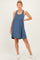 woman wearing a navy blue striped maternity dress with a relaxed fit and gathered waist