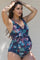 woman wearing a floral maternity swimsuit with a v-neckline and wrap detailing, showcasing her baby bump