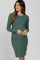 woman wearing a green long sleeve ribbed maternity dress and holding her baby bump