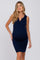 woman wearing a navy ribbed maternity dress with a v-neck and a visible baby bump