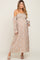 woman wearing a floral off-the-shoulder maternity maxi dress, showcasing her baby bump