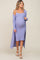 woman wearing a lavender ribbed maternity dress with spaghetti straps and a long cardigan, showing her baby bump