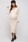 woman wearing a cream long sleeve ribbed maternity dress with button details and a visible baby bump