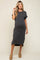 woman wearing a grey ribbed maternity dress with short sleeves and side slits, showing her baby bump.