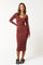 woman wearing a rust long sleeve ribbed midi dress with a scoop neckline and fitted silhouette