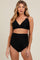 woman wearing a black scalloped edge maternity bikini top and high-waisted bottom, showcasing her baby bump