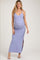 woman wearing a light purple maternity maxi dress with a deep v-neck and side slits, showcasing her baby bump
