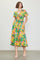 woman wearing a vibrant yellow floral midi dress with puff sleeves and pockets