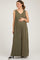 woman wearing a green striped maternity jumpsuit with buttons and a visible baby bump