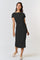 woman wearing a black fitted midi dress with short sleeves and a side tie detail