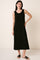 woman wearing a black sleeveless maxi dress with side slits and a relaxed fit