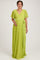 woman wearing a lime green pleated maternity wrap dress with short flutter sleeves and a tie waist, displaying her baby bump