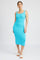 woman wearing a fitted turquoise knit midi dress with a square neckline and wide straps