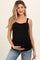 woman wearing a black maternity tank top and holding her baby bump