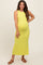 woman wearing a bright yellow sleeveless maternity maxi dress with a fitted silhouette and a visible baby bump