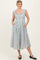 woman wearing a light blue floral midi dress with cap sleeves and pockets