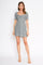 woman wearing a short puff sleeve black and white floral dress with a sweetheart neckline and fitted silhouette