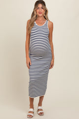 woman wearing a navy and white striped maternity tank dress featuring a fitted silhouette and a visible baby bump