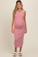 woman wearing a red and white striped maternity tank dress showcasing her baby bump