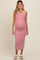 woman wearing a red and white striped maternity tank dress showcasing her baby bump