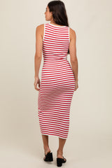 woman wearing a fitted red and white striped midi dress, showing the back view with a scoop neckline and ribbed texture