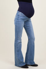 maternity wear blue bootcut jeans with a stretchy dark blue belly panel and visible baby bump