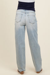 woman wearing light blue maternity jeans, viewed from the back